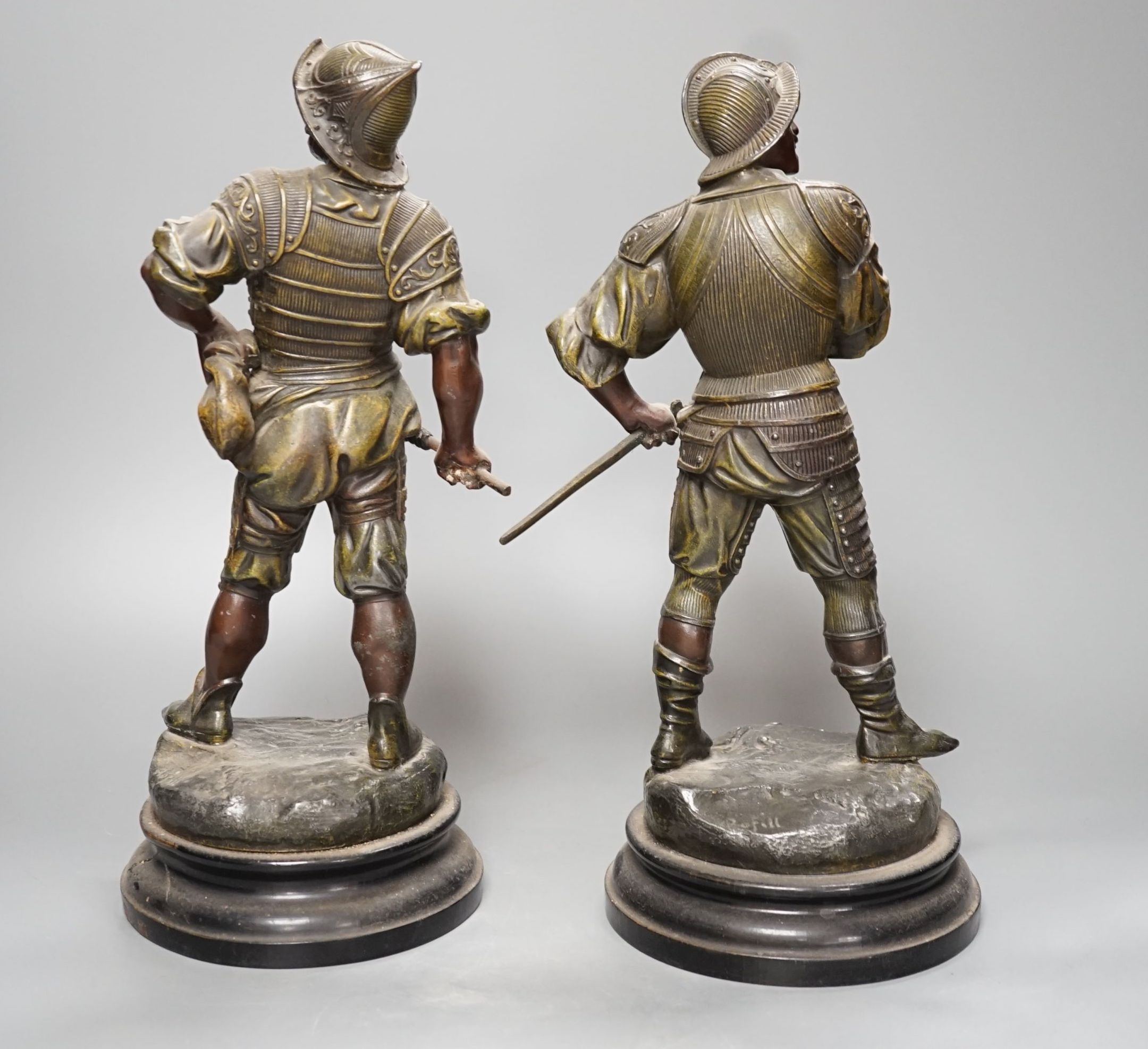 A pair of late Victorian bronzed spelter figures of 17th century soldiers - 33cm high